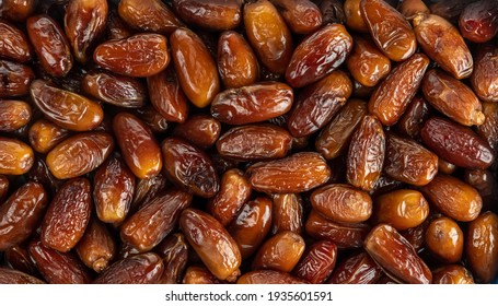 The surface texture of selected dried dates. Natural oriental sweets. - Shutterstock ID 1935601591