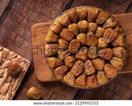 The surface texture of selected dried dates. Natural oriental sweets.