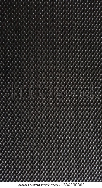The surface of the treadmill material is\
black, is a pattern suitable for\
adhesion.
