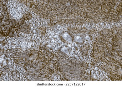 Surface of the water of the rio Magdalena en Colombia, near San Agustin (San Agustín), Huila. Beautiful bubbles and movement. Makes a nice abstract. - Shutterstock ID 2259122017