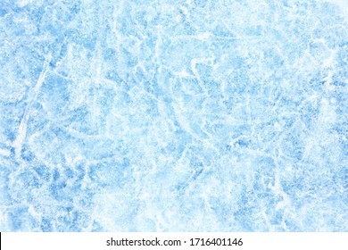 Surface of winter ice on Baikal lake in Siberia . Blue background of Ice texture 