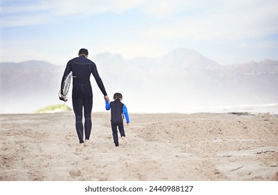 Surfboard, man and child on beach, walking and holding hands on outdoor bonding adventure. Nature, father and son at ocean for surfing, teaching and learning together with support, trust and growth. - Powered by Shutterstock