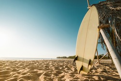 Surfboard On Beach. Seascape Of Summer Beach With Sea And Blue Sky Background.