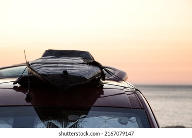 Surfboard On The Roof Of A Van