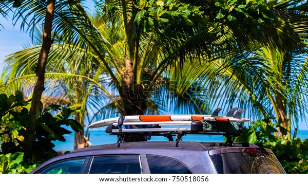 Surfboards at car.\
Costa Rica, surfing\
paradise