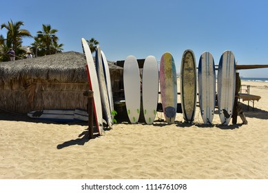 Surfboards On Sand Beach In Baja, Mexico