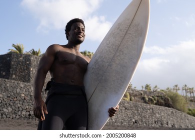 Surfer African American Man Holding Longboard Before Surf Session - Extreme Sport Lifestyle