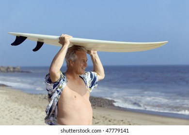 Surfer Carrying Surfboard - Powered by Shutterstock