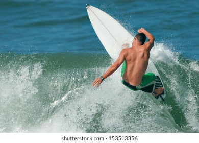 A Surfer Carves A Radical Off-the-lip.