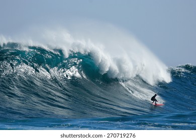 A Surfer Catches A Huge Wave.