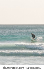 Surfer Catching Small Wave On Longboard At Wedge Island, Western Australia