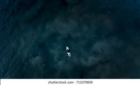 Surfer In Dark Ocean, Aerial Perspective