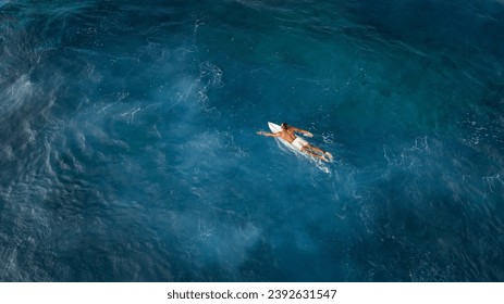 Surfer in deep ocean hawaii - Powered by Shutterstock