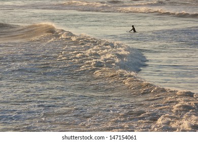 Surfer at dusk