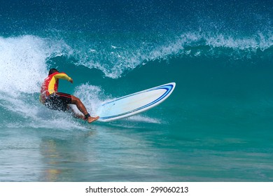Surfer enjoys the waves in kata beach, Phuket. Thailand.