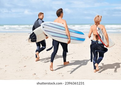 Surfer friends, running and back at beach with board, training or fitness on vacation in summer. Men, woman and surfboard for wellness, health or workout by ocean, waves or freedom on holiday on sand - Powered by Shutterstock