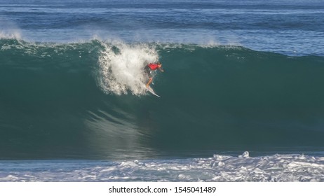 A Surfer Getting A Tube Ride At Pipeline On The Island Of Oahu In Hawaii