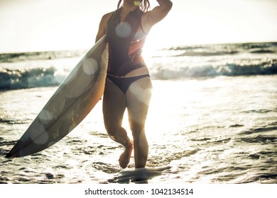 Surfer Girl Going In The Water