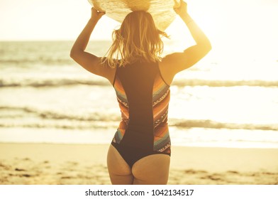 Surfer Girl Going In The Water