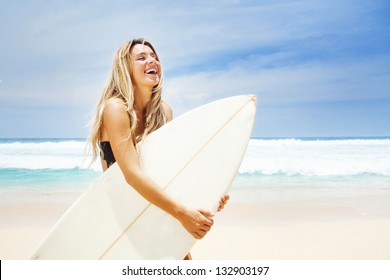 Surfer girl on the beach of bali