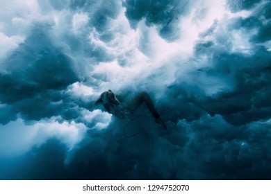 Surfer Girl With Surfboard Under Wave. Underwater Wipeout