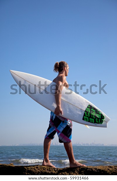 Surfer Holding His Board Walking On Stock Photo (Edit Now) 59931466