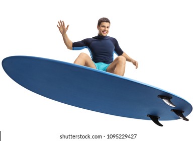 Surfer Jumping With A Surfboard Isolated On White Background