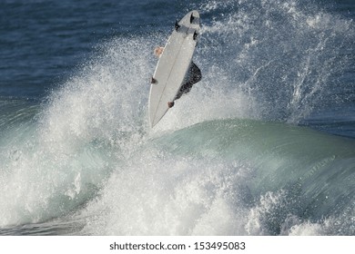 A Surfer Launches A Huge Aerial On A Wave.