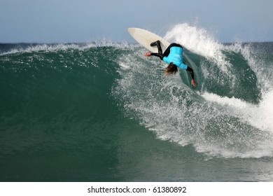 Surfer Making A Radical Turn On A Large Wave