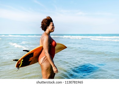 Surfer at a nice beach - Powered by Shutterstock