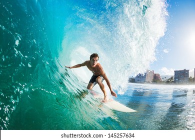 Surfer on Blue Ocean Wave Getting Barreled - Shutterstock ID 145257634