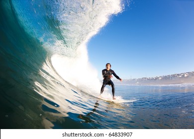 Surfer On Large Blue Wave