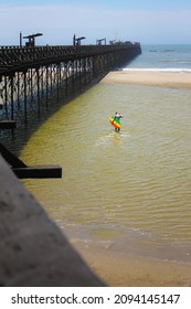 Surfer On The Pier Of Pimentel 