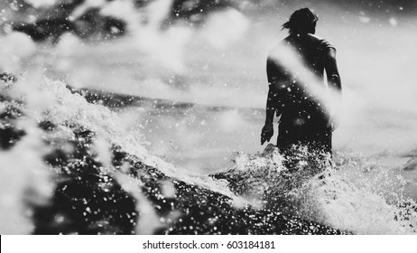 Surfer On The Wave, Catches A Wave, Surfing In The Pipe. Surfing In The Ocean On The Island Of Bali, A Mellow Man, A Jump Into The Ocean. Taken From The Water. 