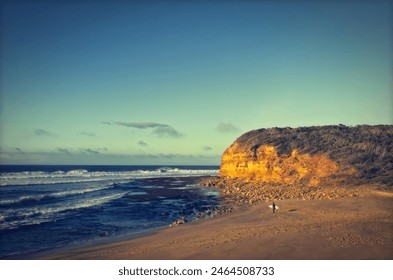 Surfer preparing to paddle out at Bells Beach, Great Ocean Road, Victoria, Australia - Powered by Shutterstock