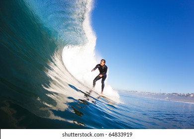 Surfer Riding Large Blue Wave