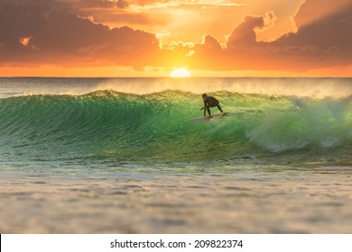 Surfer at Sunrise with Perfect Wave
