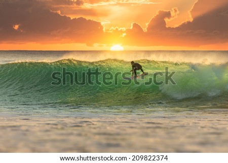 Similar – Image, Stock Photo Surfers on the beach go to the sea