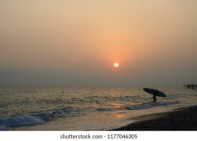 Surfer at sunset