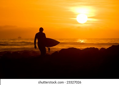 Surfer In Sunset