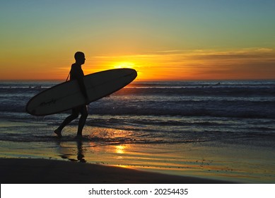 Surfer at sunset. La Jolla Shores. San Diego, California