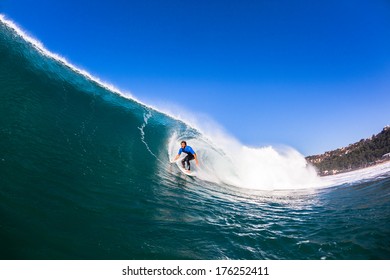 Surfer Surfing Large Wave Surfer Catching Large Blue Wave, A Swimming View Of Surfing Action.