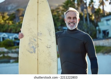 Surfer, surfing and portrait of old man at the beach with his surfboard. Ocean, surf and senior man doing water sports in Australia. Summer, travel and happy mature guy enjoying retirement by the sea - Powered by Shutterstock