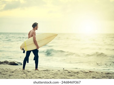 Surfer, walking and man on beach at sunset for adventure in summer, holiday or travel in vacation. Person, surfing and search for waves in Australia water, ocean and exercise in sea with board - Powered by Shutterstock