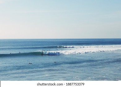 Surfers Enjoy The Swell At The Famed Malibu Surf Break In Los Angeles, California.