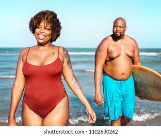 Surfers at a nice beach - Powered by Shutterstock