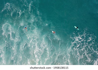 Surfers In The Ocean - Aerial Image