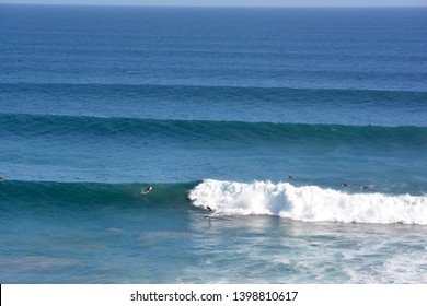 Surfers On Big Waves In Malibu