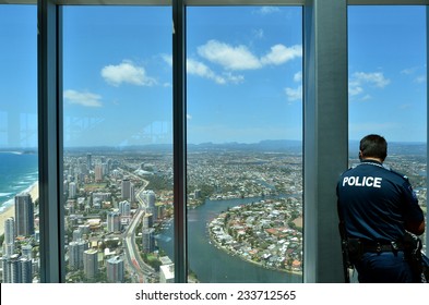 SURFERS PARADISE - NOV 14 2014:Police Officer Patrols In Skypoint Observation Deck.Gold Coast Police On High Terror Alert Warned To Be Hyper Vigilant And Patrol Local Critical Infrastructure Sites