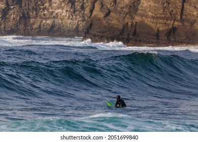 Surfers Ride The Waves In Vladivostok In Winter.